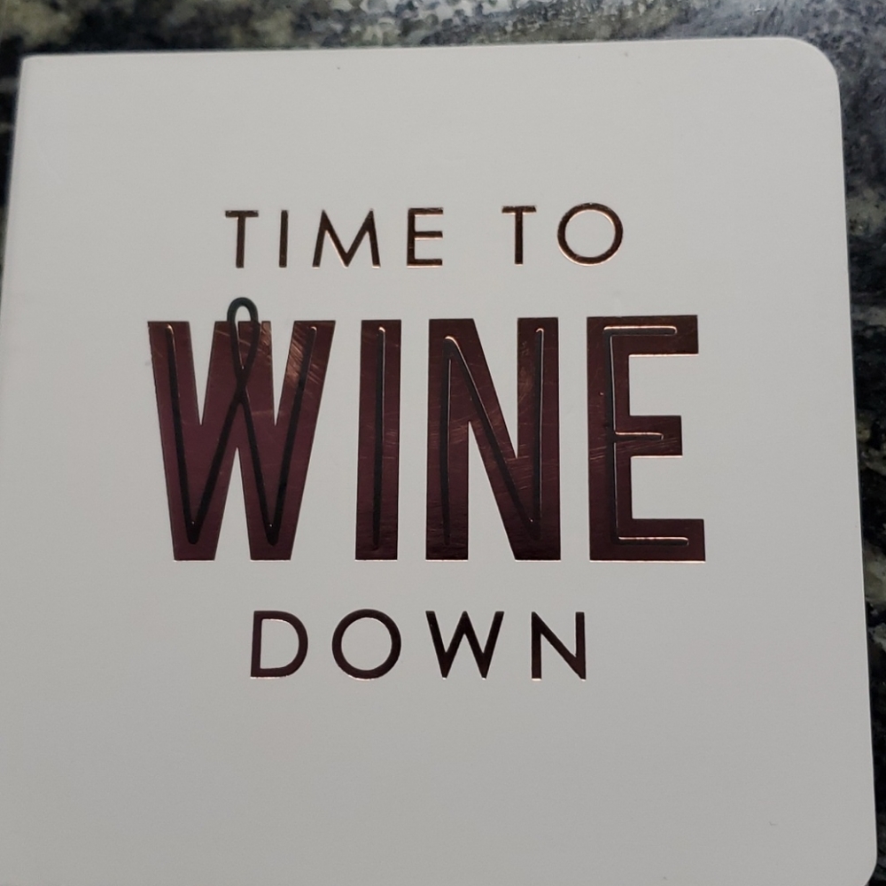 Wine coaster book with 6 pop out coasters. NEE